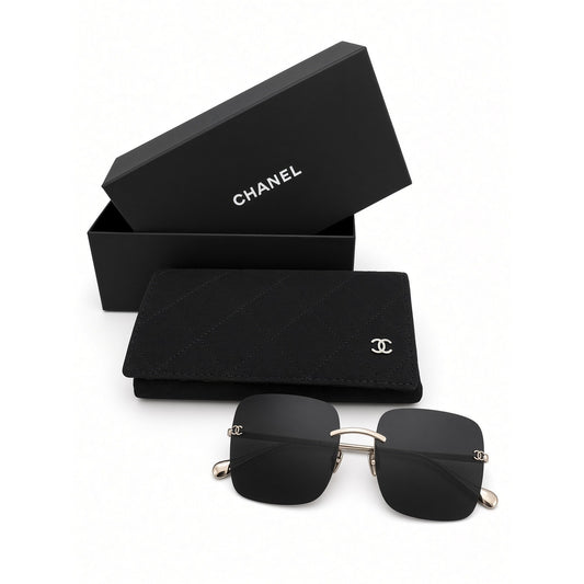 $900 | Chanel CH4287T square titanium sunglasses
Light gold / silver titanium · gray lenses