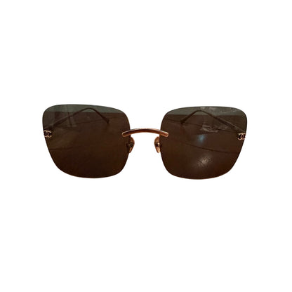 $900 | Chanel CH4287T square titanium sunglasses
Light gold / silver titanium · gray lenses