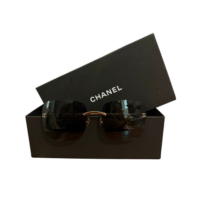 $900 | Chanel CH4287T square titanium sunglasses
Light gold / silver titanium · gray lenses