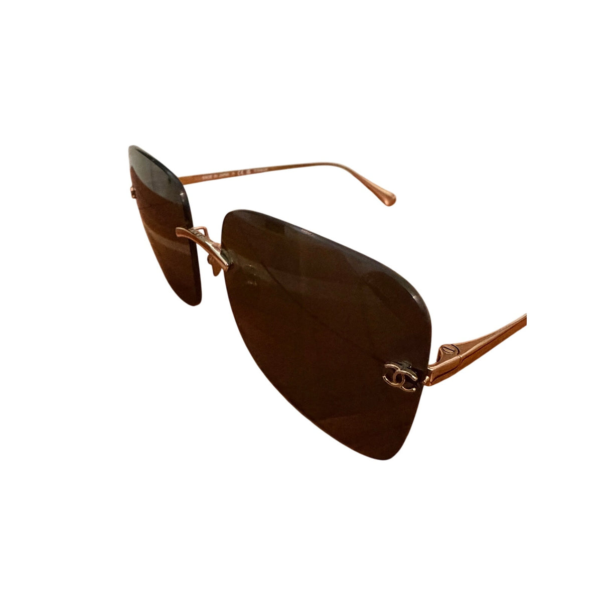 $900 | Chanel CH4287T square titanium sunglasses
Light gold / silver titanium · gray lenses
